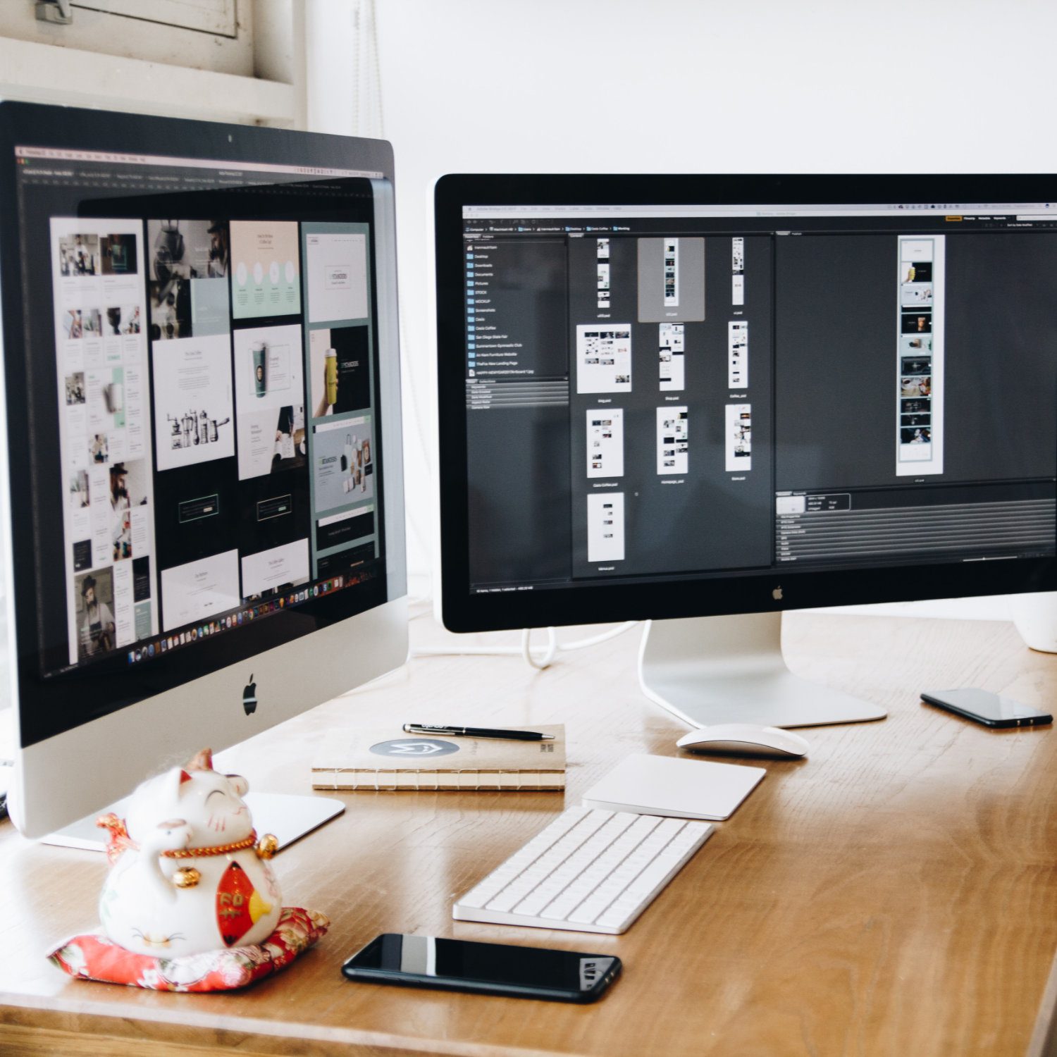 Two iMacs displaying mockups of a website